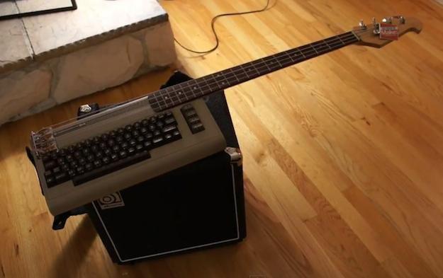 there is an electric guitar on top of the typewriter