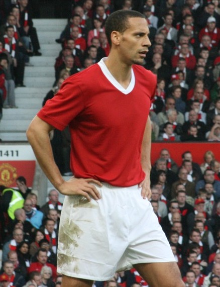 a man with the red and white soccer uniform
