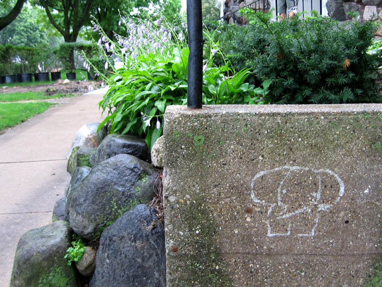 a concrete block sits on the edge of a sidewalk