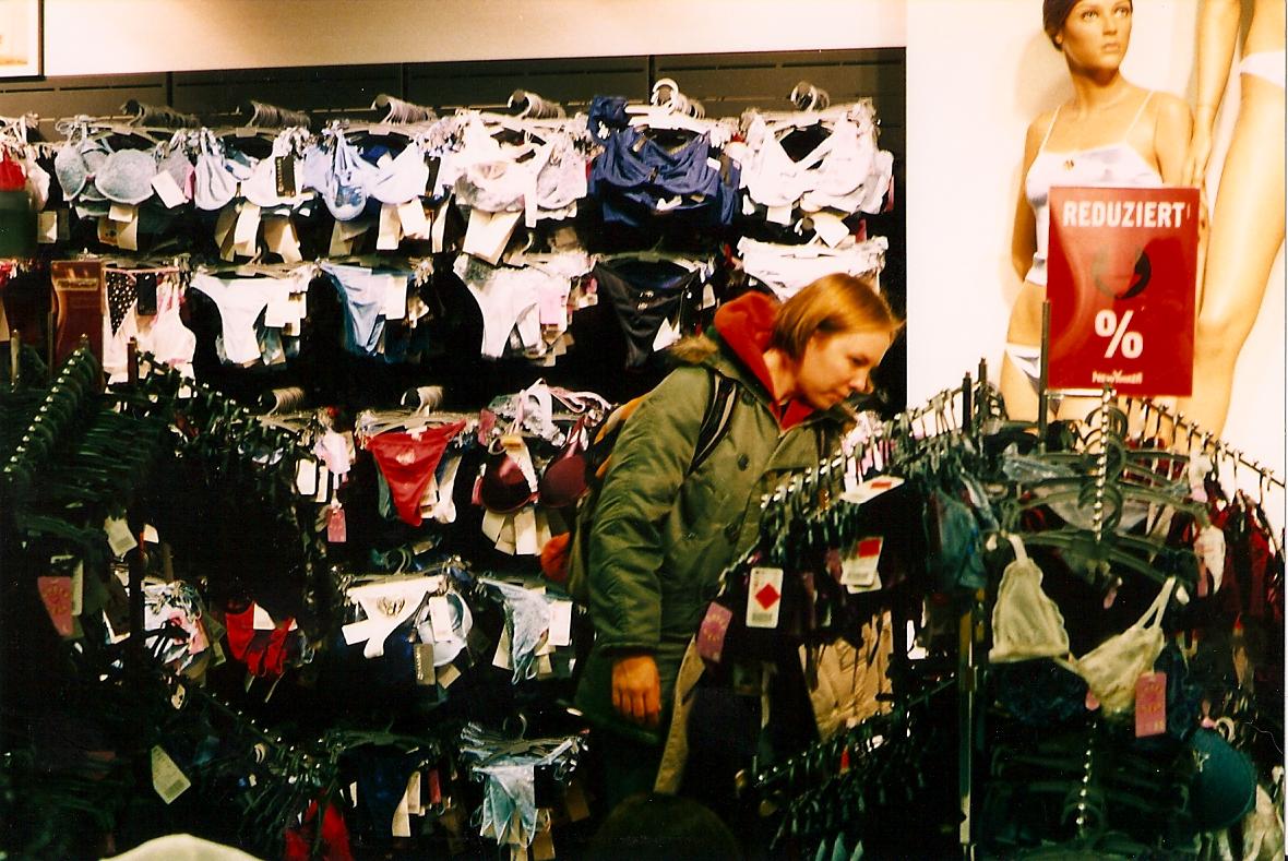 boy browsing items in department store at an open market