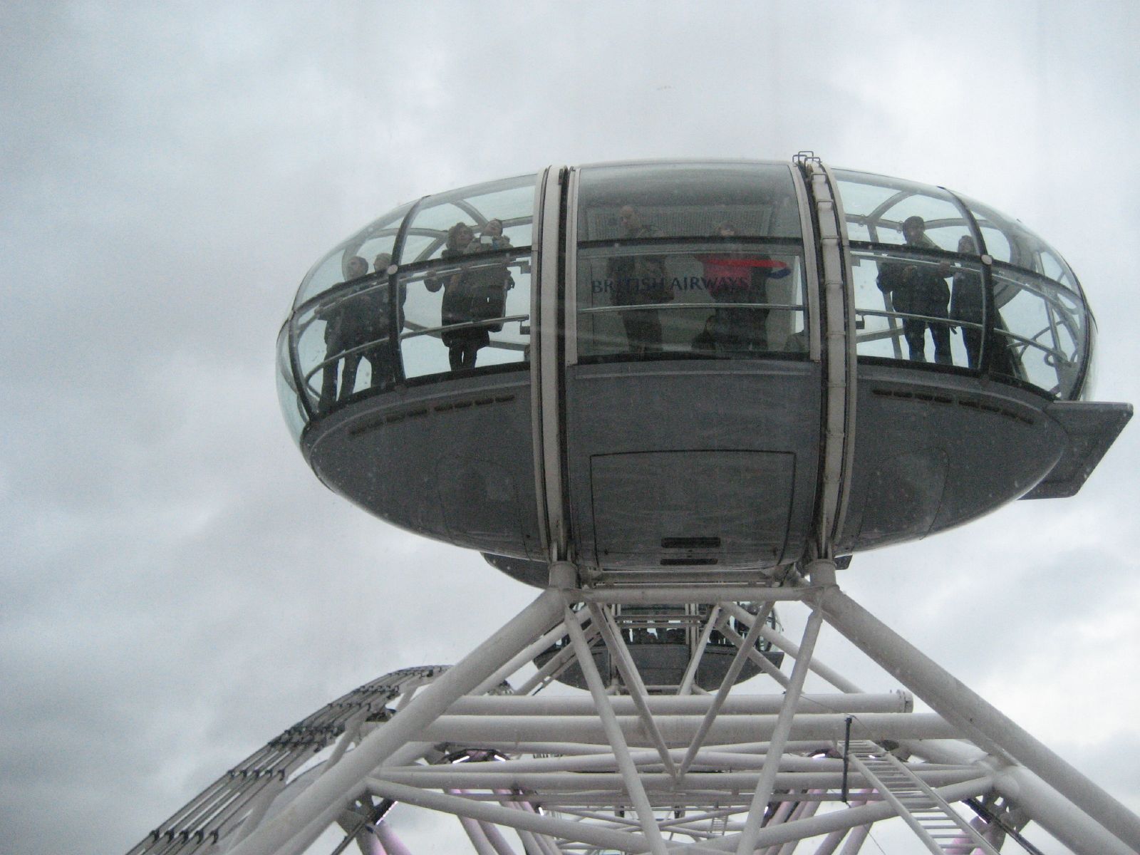 people on a ferris wheel during the day