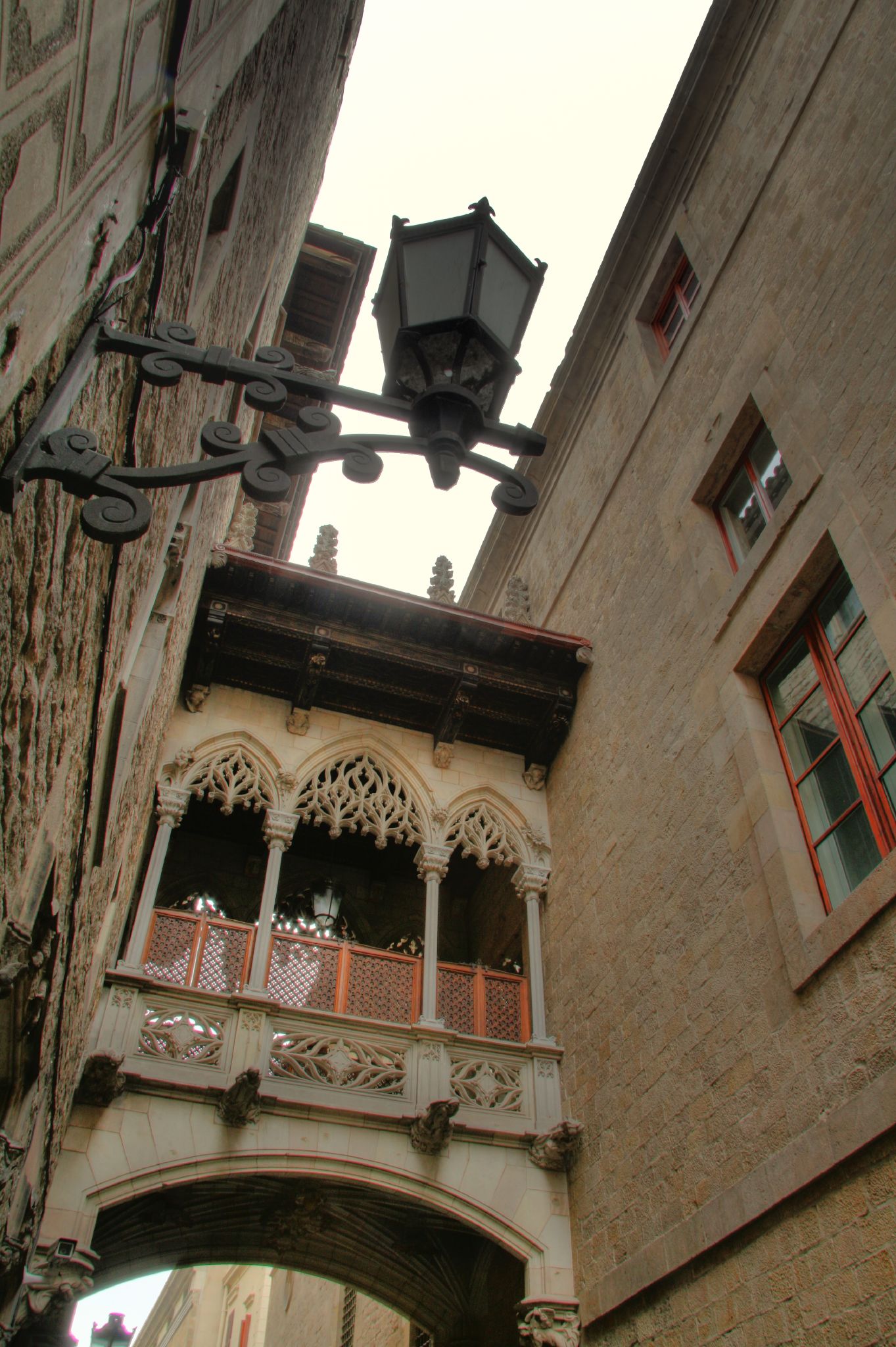 a lamppost in front of an old building
