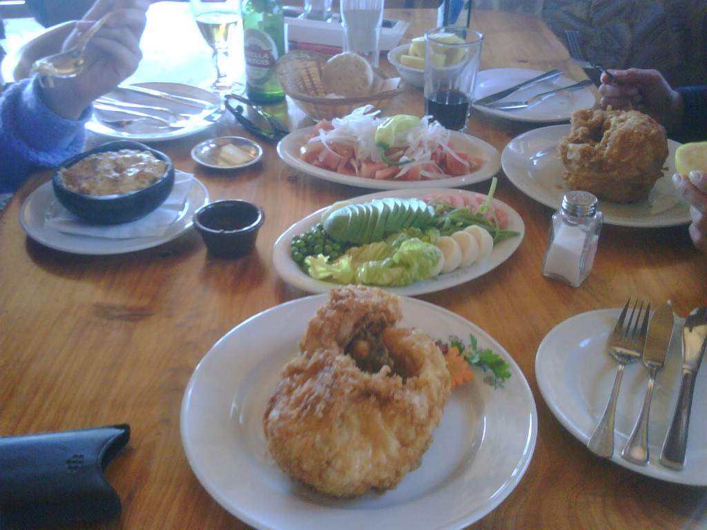 several plates on a table with food at each