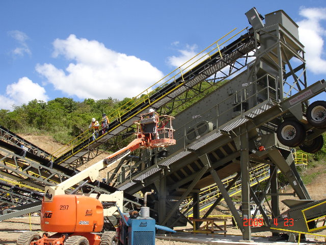 large cement crusher machine working on a hill
