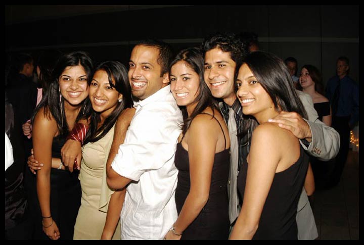 young adults smiling and posing for pograph
