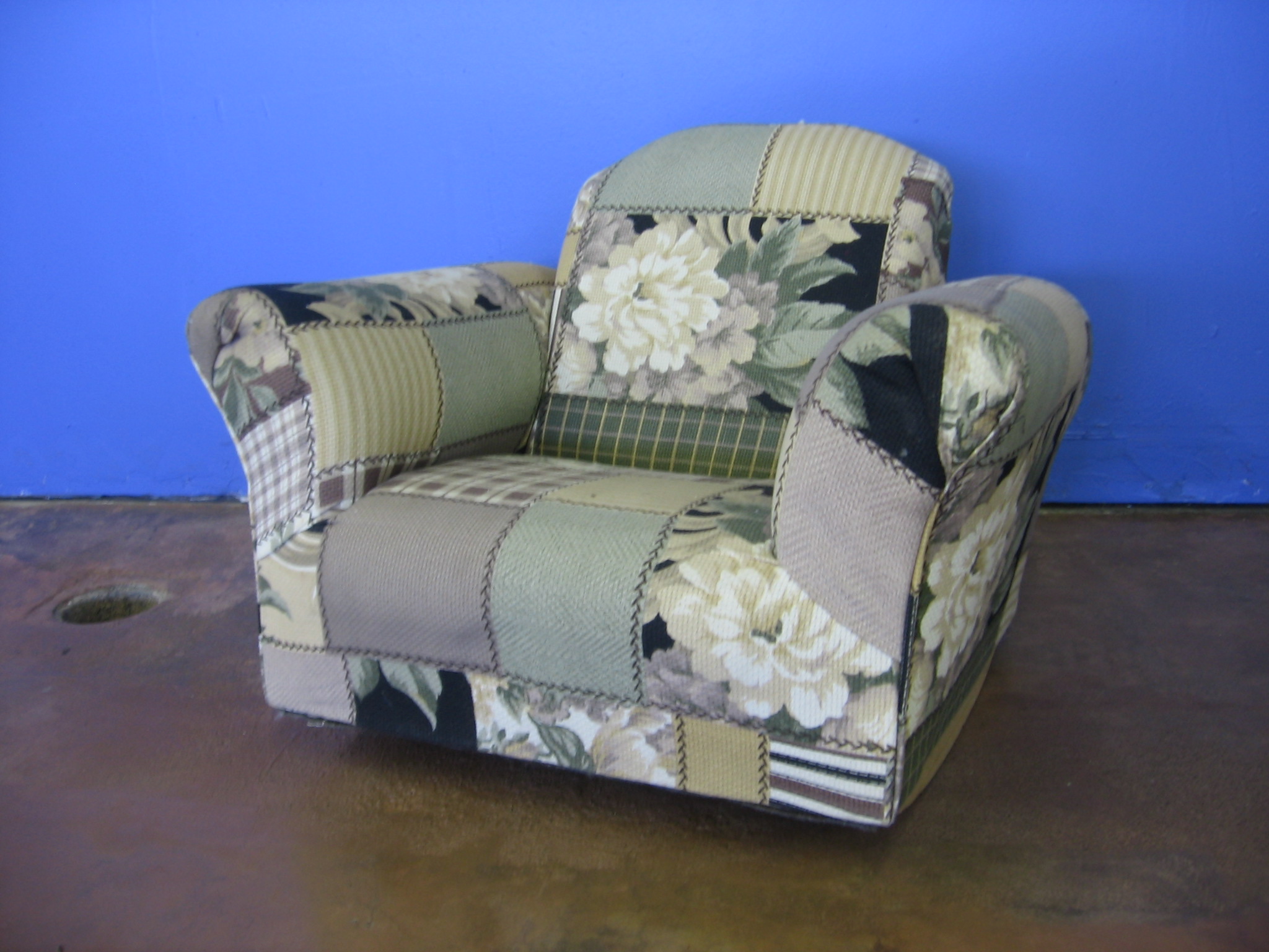 this chair is covered with floral fabric