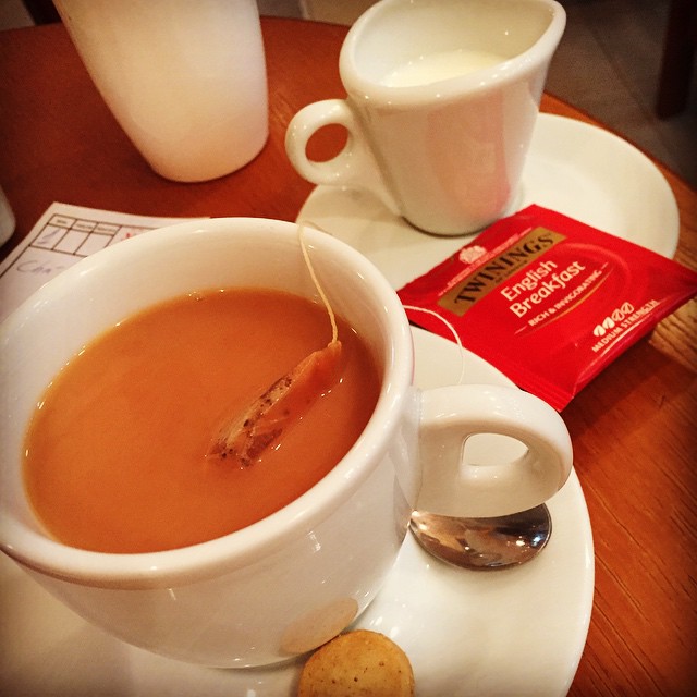 some coffee sitting on a table with other food items