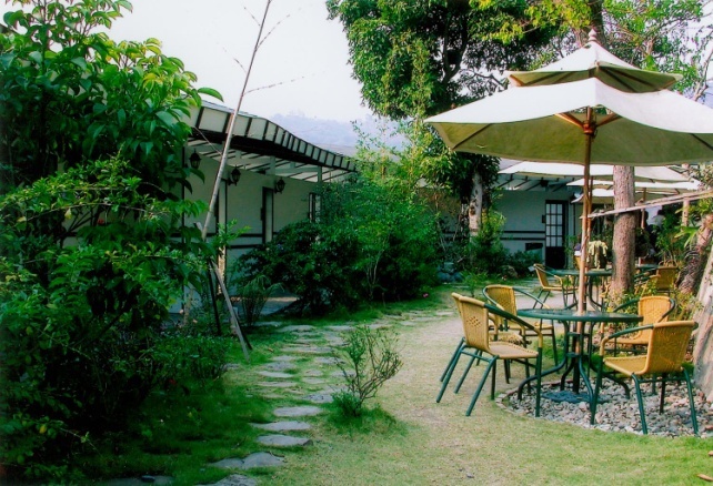 there is a very nice outdoor patio with nice chairs and umbrella