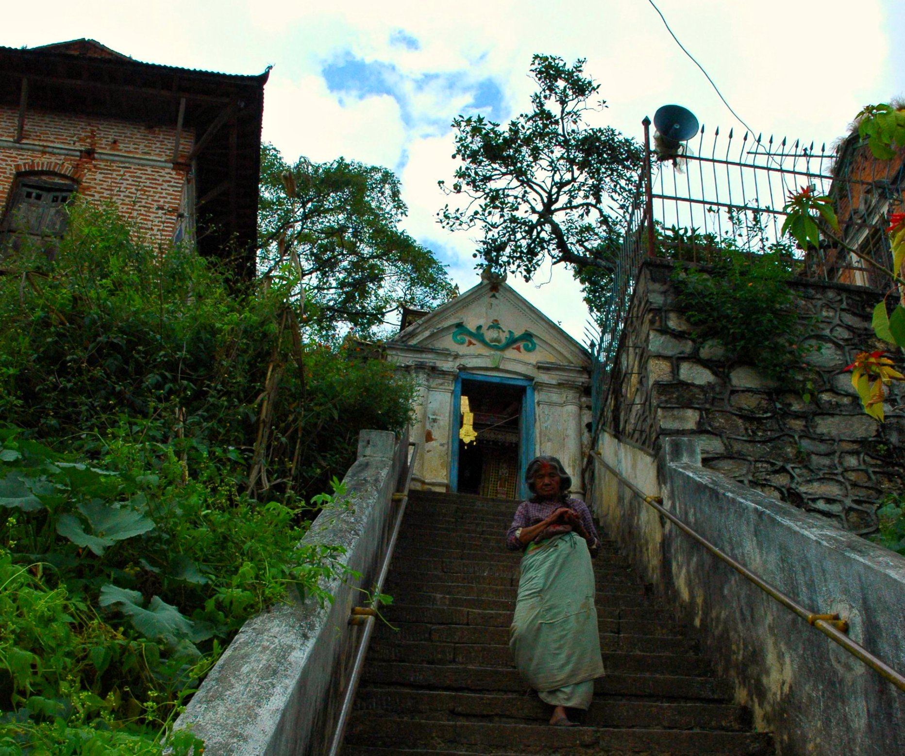 a person walking down the stairs of an old building