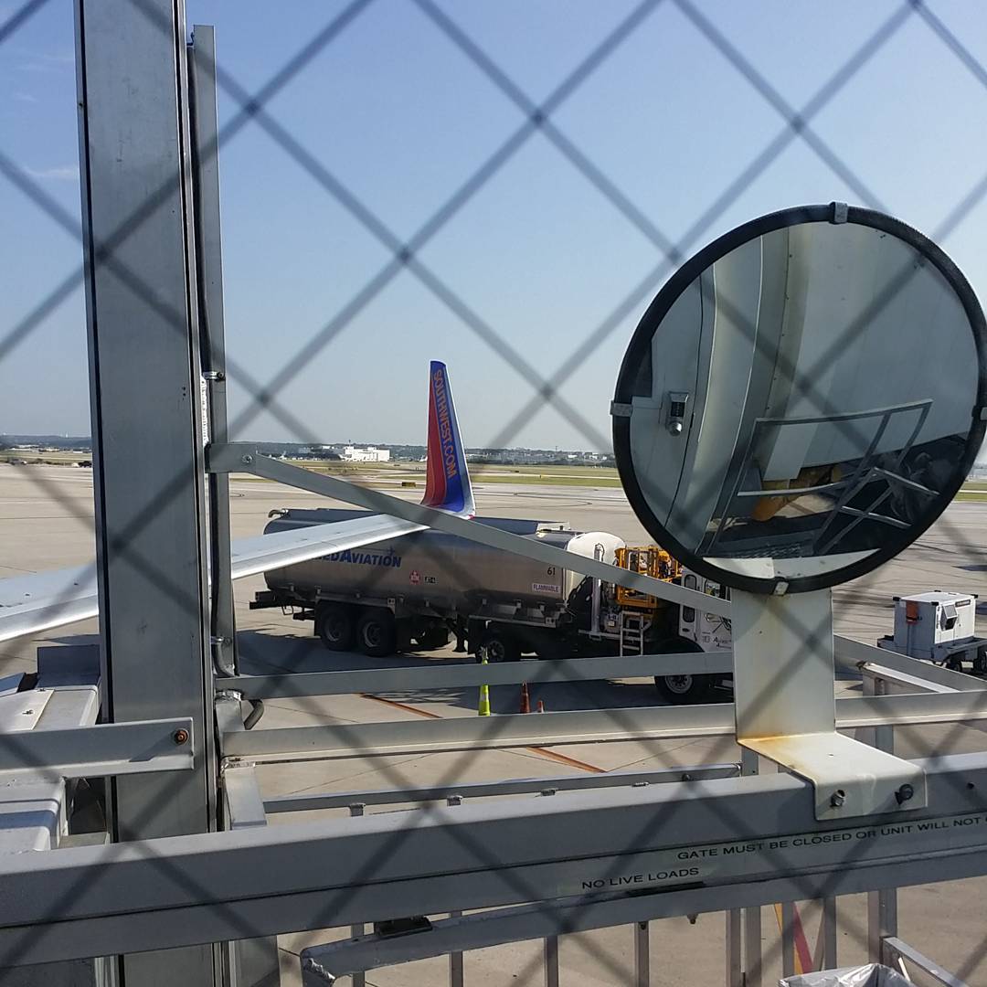 a jumbo jet airliner is parked on the tarmac