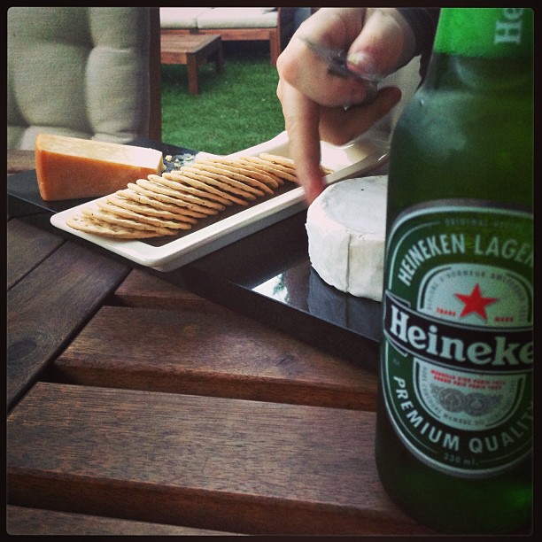 a bottle of heineken lager and ers on the table