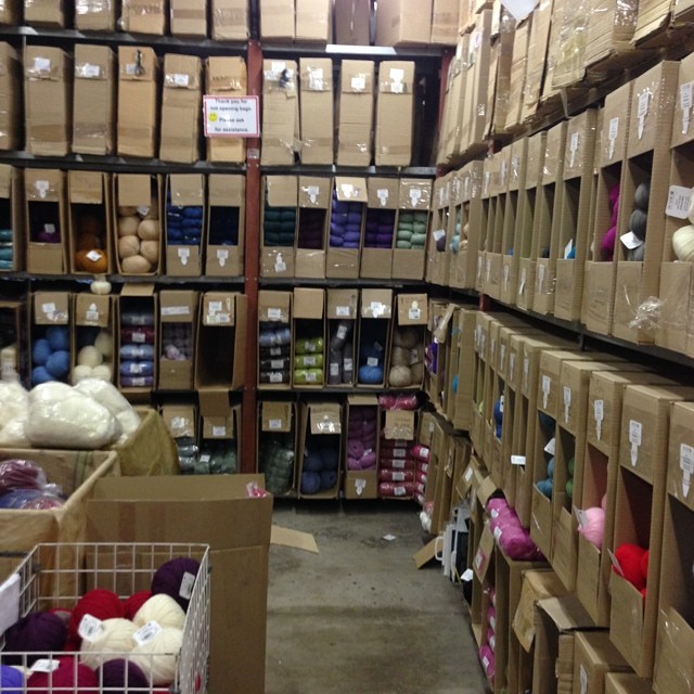 a very large warehouse with lots of boxes and yarn
