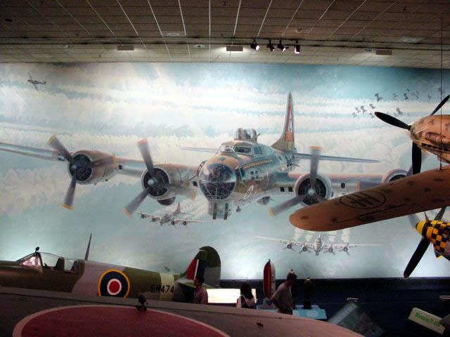 a wall with pictures and planes on it