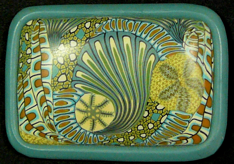 a rectangular bowl with a design on the front