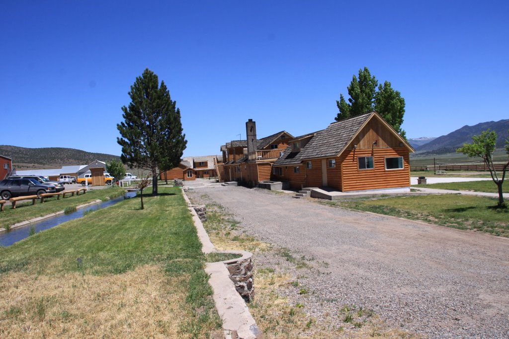 several houses lined up on a dirt road