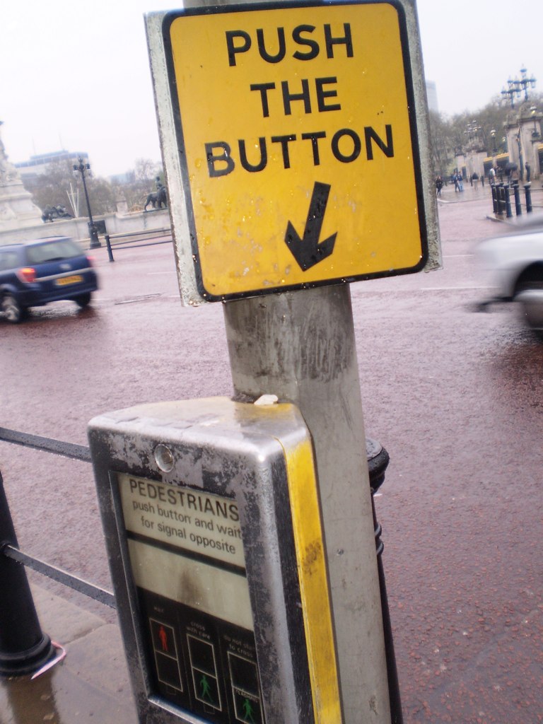 a h the on sign next to a parking meter