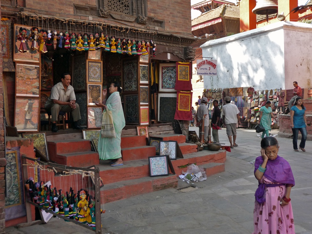 many people in an indian market shopping at a place