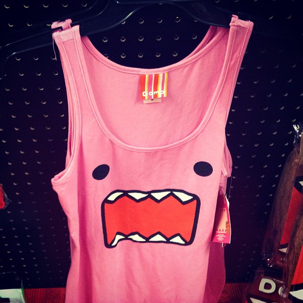 a pink tank top with a mouthy monster drawn on it