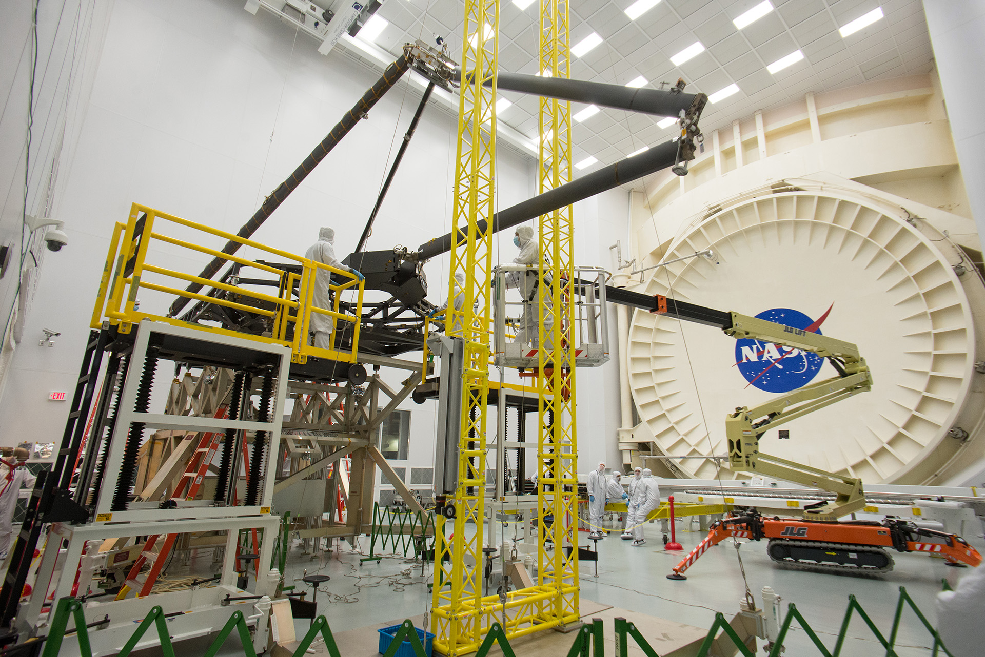 inside of an airplane hanger with lots of equipment