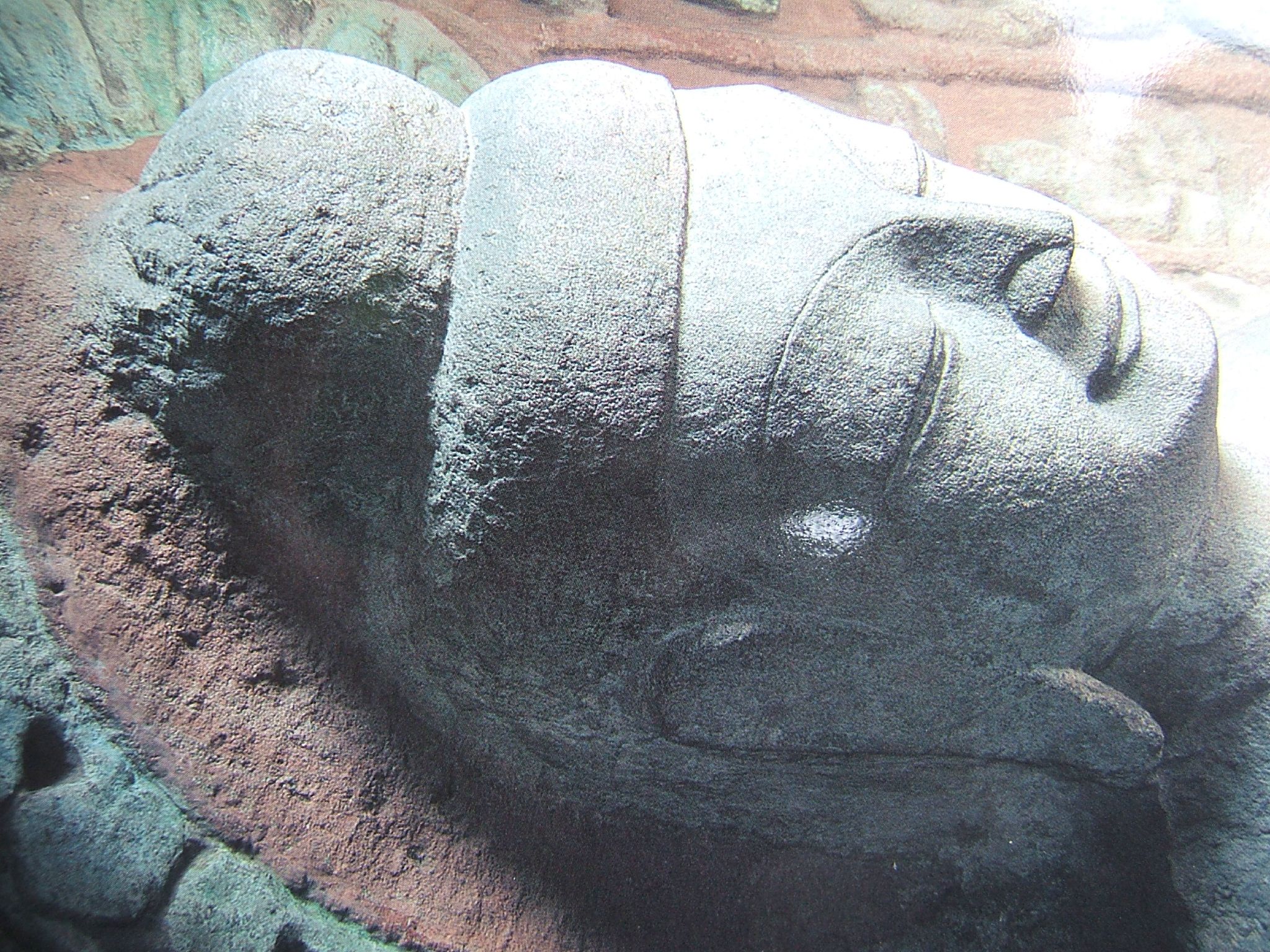 a large statue that is laying down