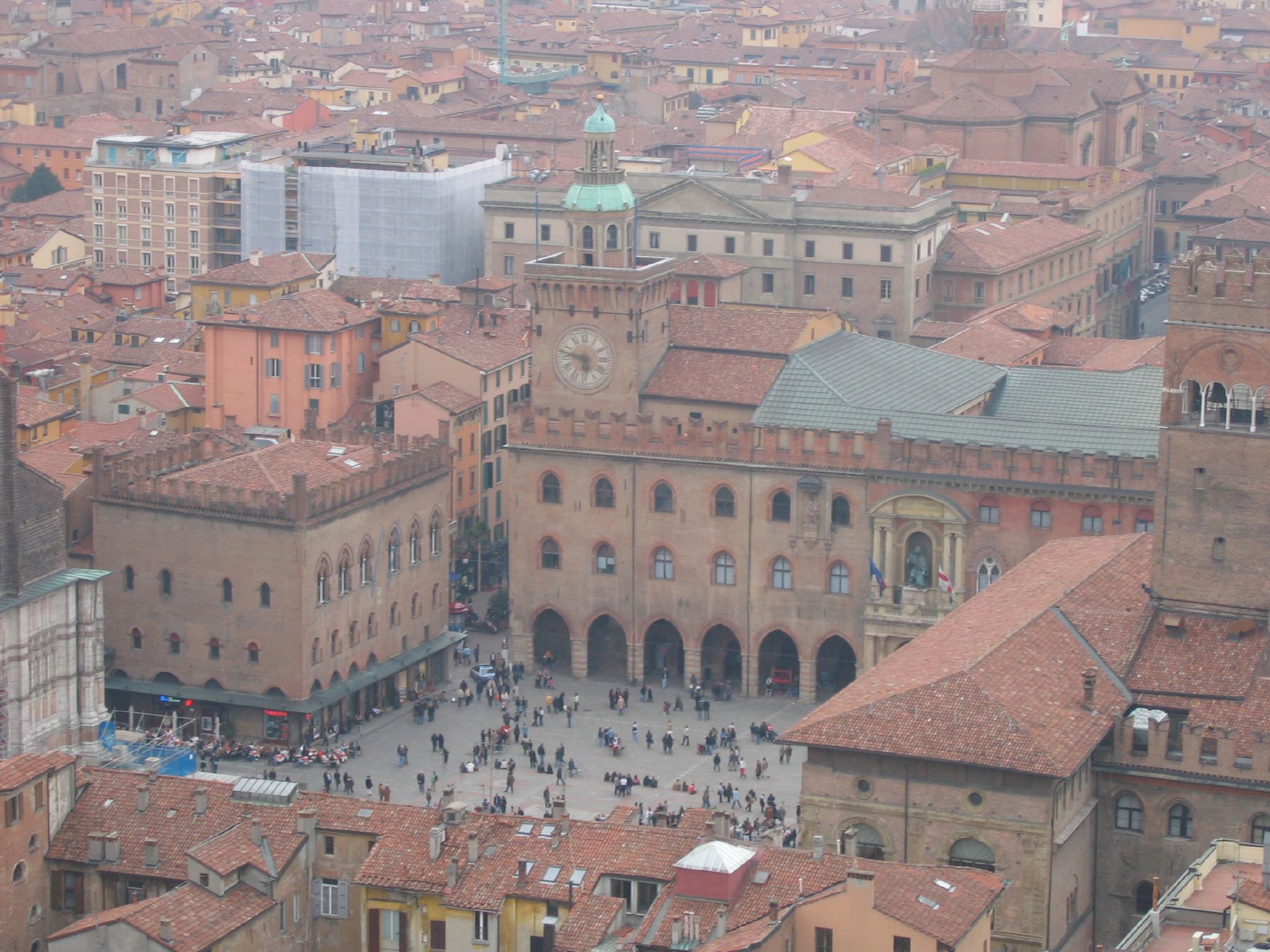 city center with many red tiled buildings in the rain