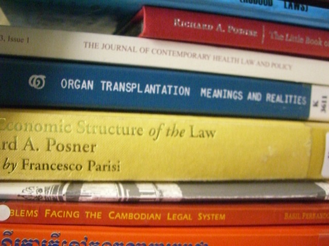 several books on law in french and a stack of them