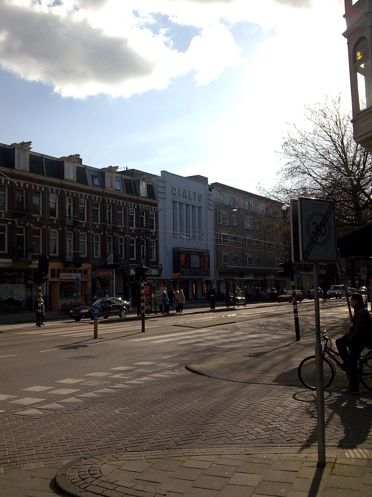 an image of people walking around in the afternoon