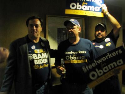 three men with signs standing outside a obama campaign store