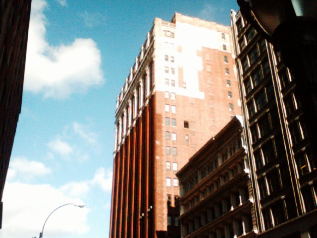 a tall building near the top of other buildings