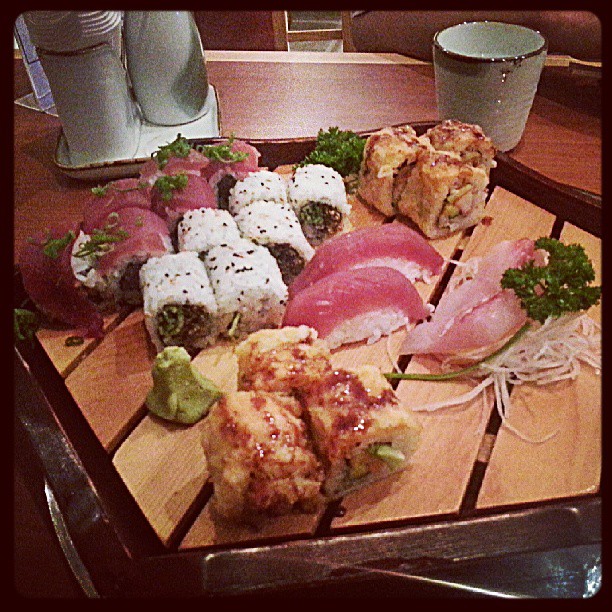 different sushi dishes are served on a tray