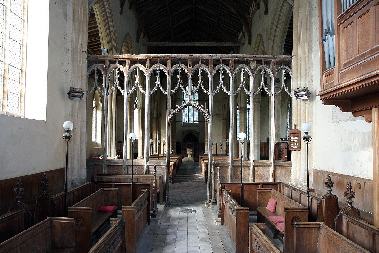 a church with high pews and a tall ceiling