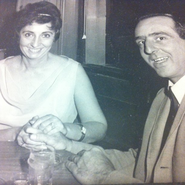 an old black and white po of two people at a table