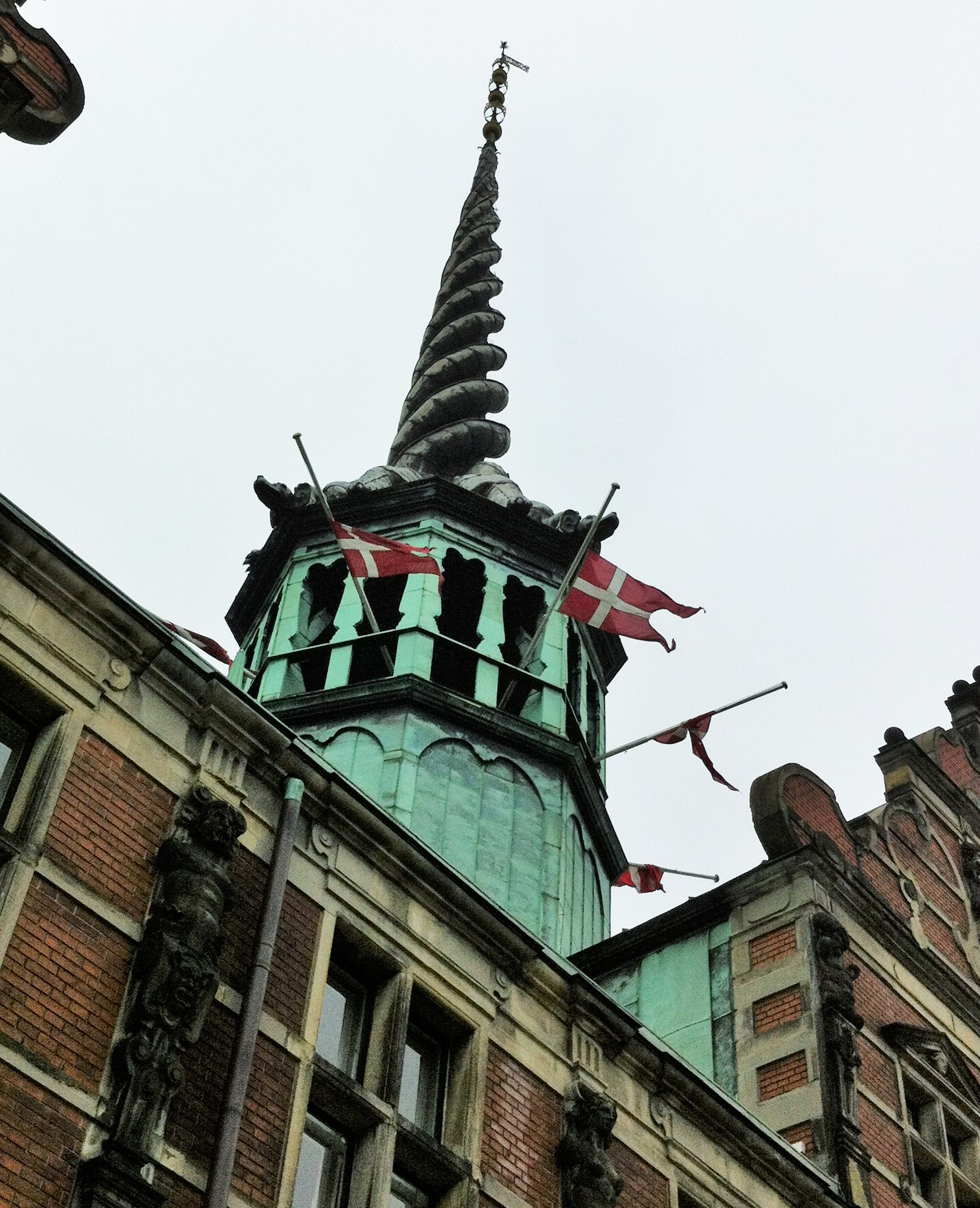 looking up at the steeple of a building