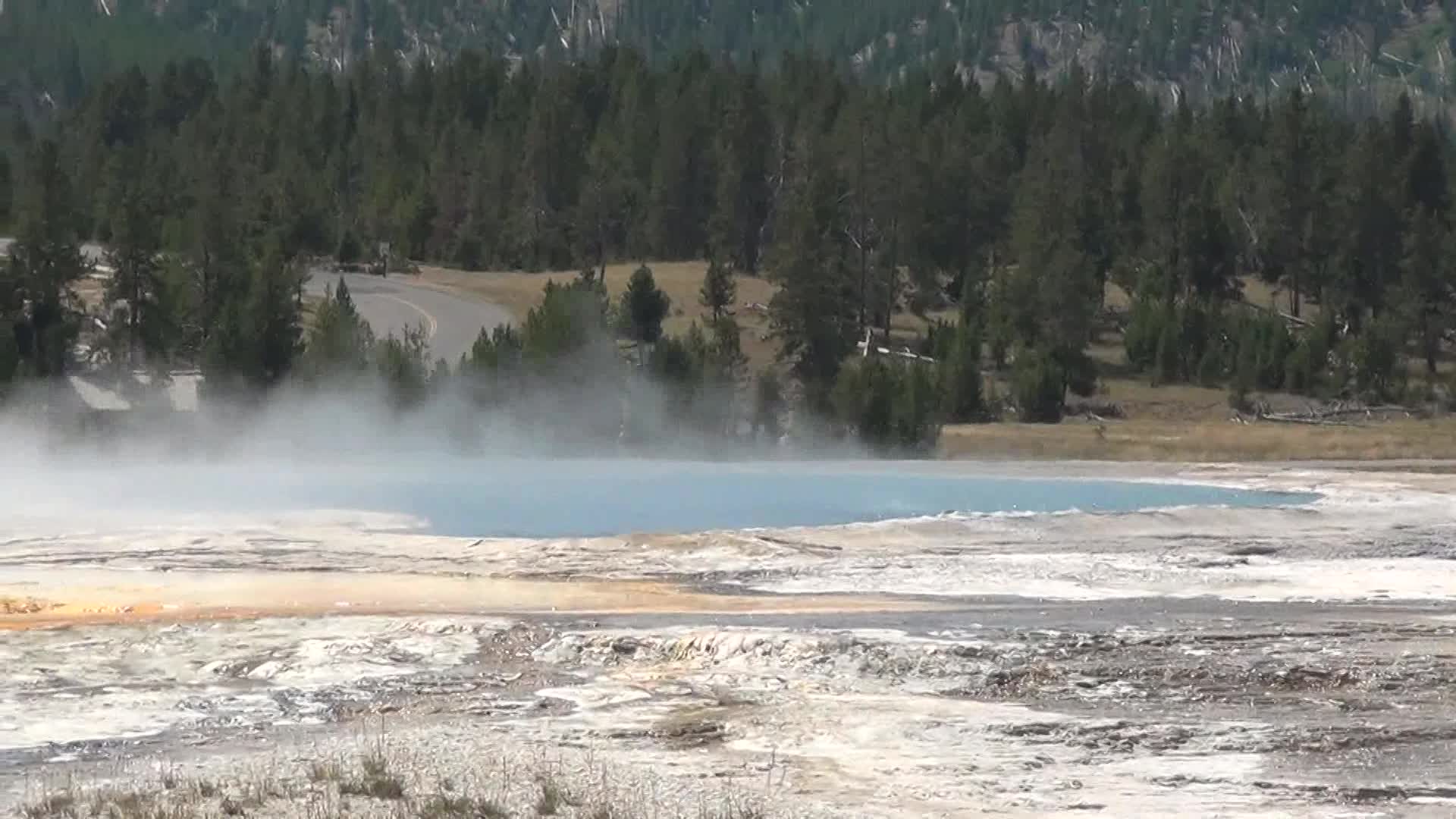 some steam comes out from a lake and it's in the middle
