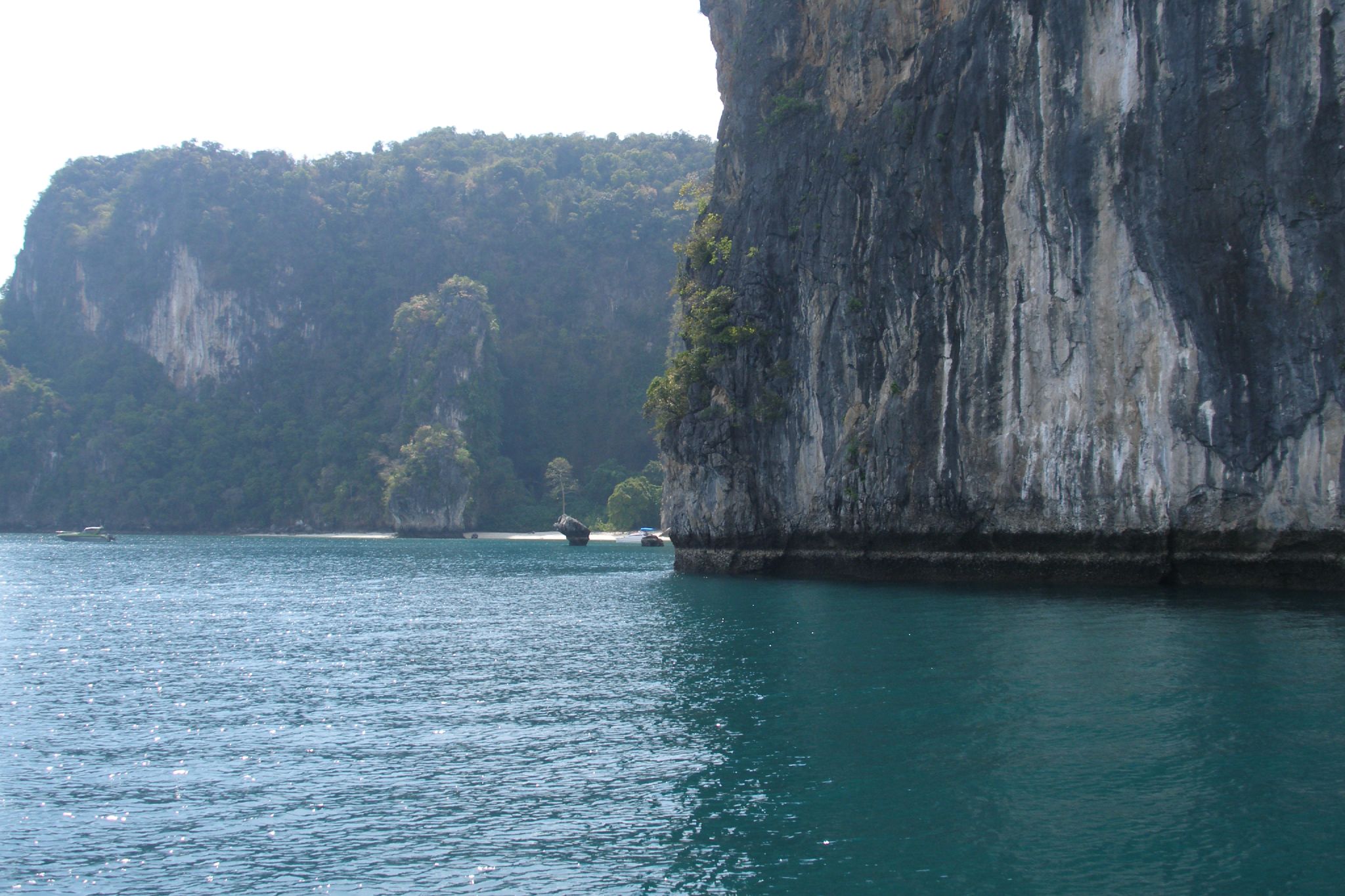 an ocean filled with lots of water and some cliffs