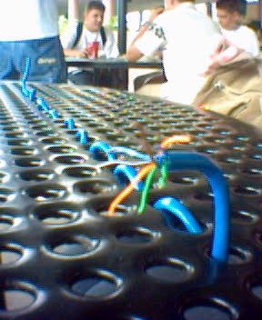 the inside of a conveyor belt is covered with cords and plastic tubes