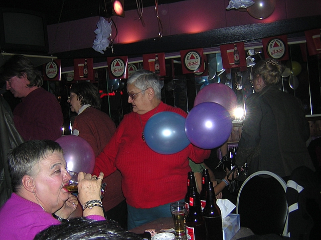 a person standing in front of two balloons
