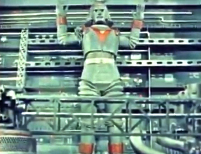 this robot is standing up in a factory