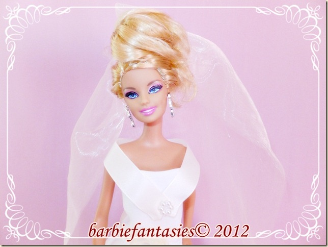 a barbie doll wearing a wedding dress and veil