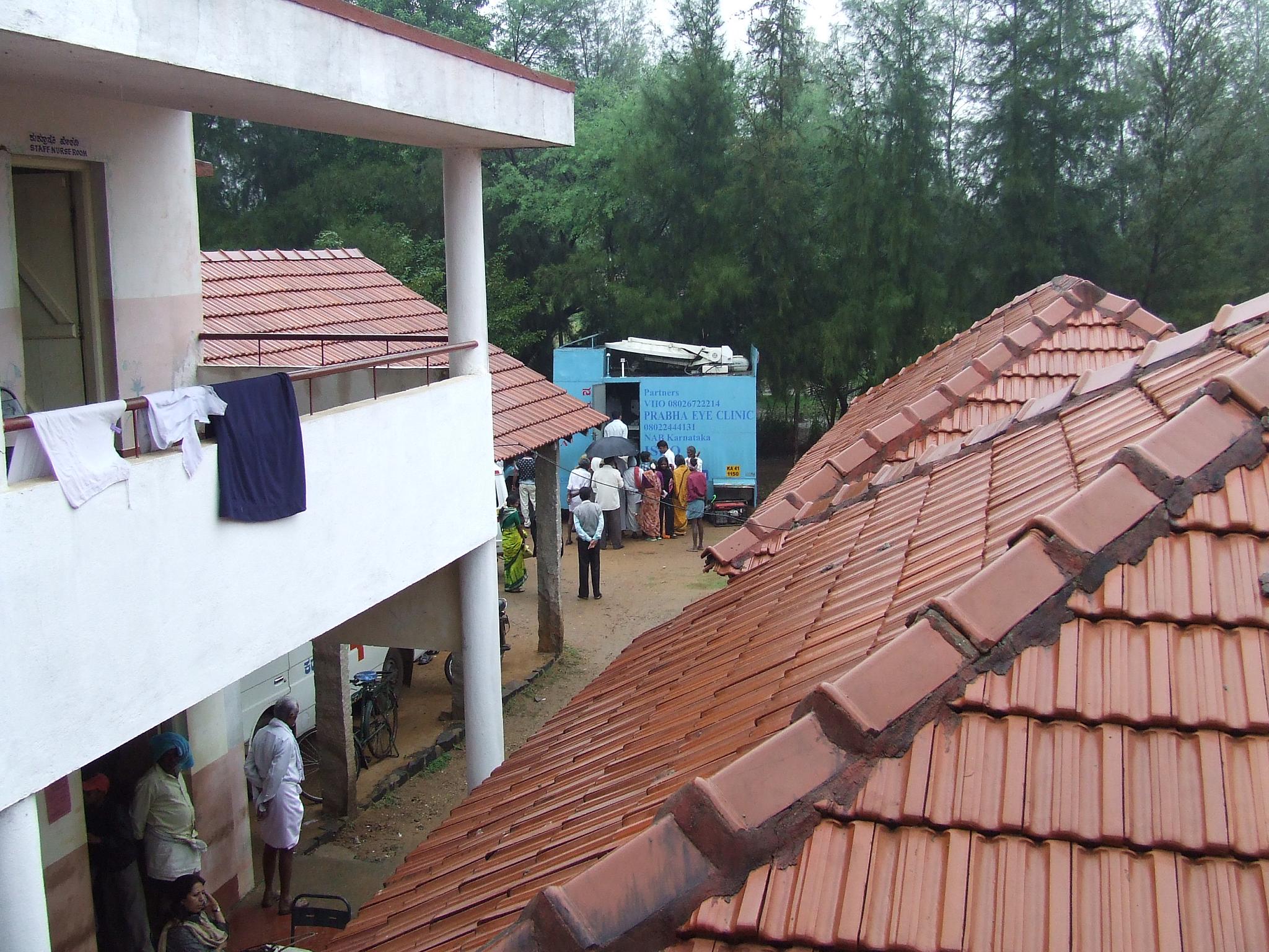 a large group of people standing on top of a roof