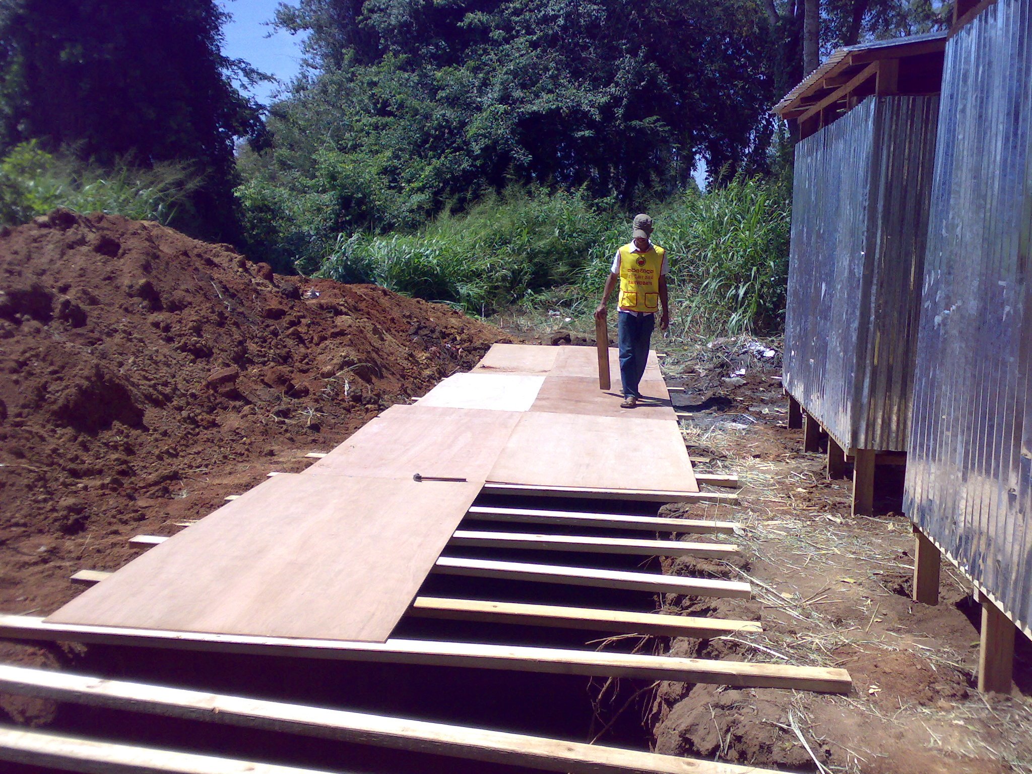 a man is walking down some construction steps