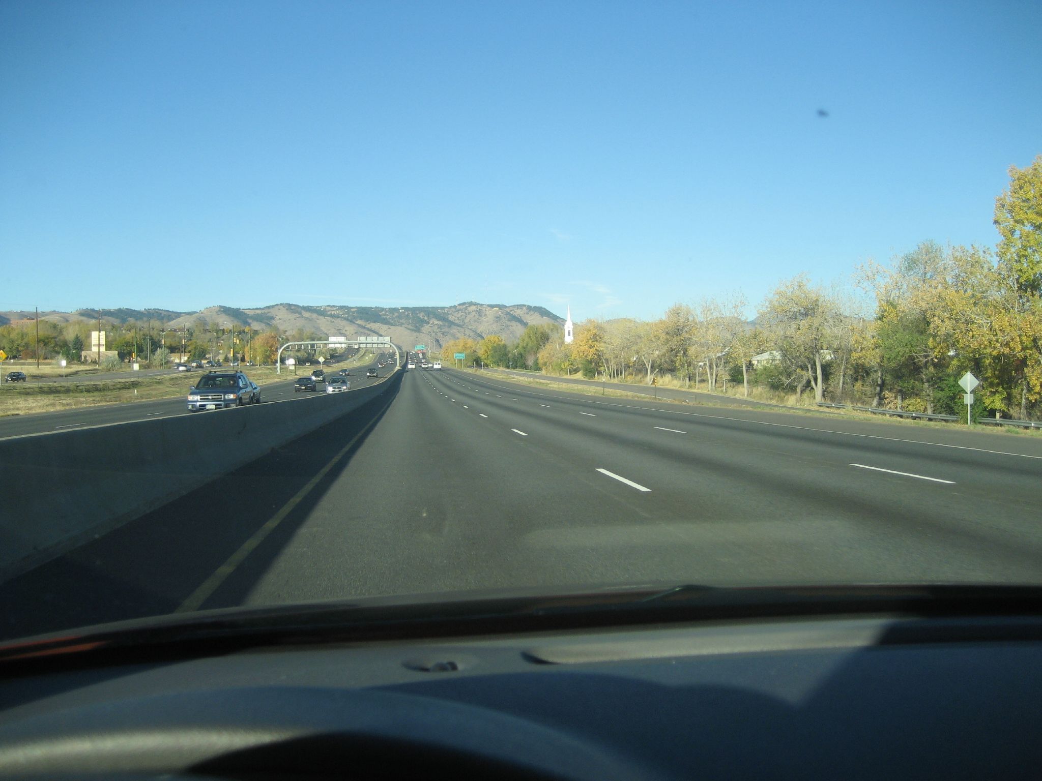 view from driver's seat of the highway in the mountains