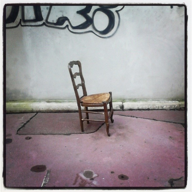 a chair sitting in the corner of an area