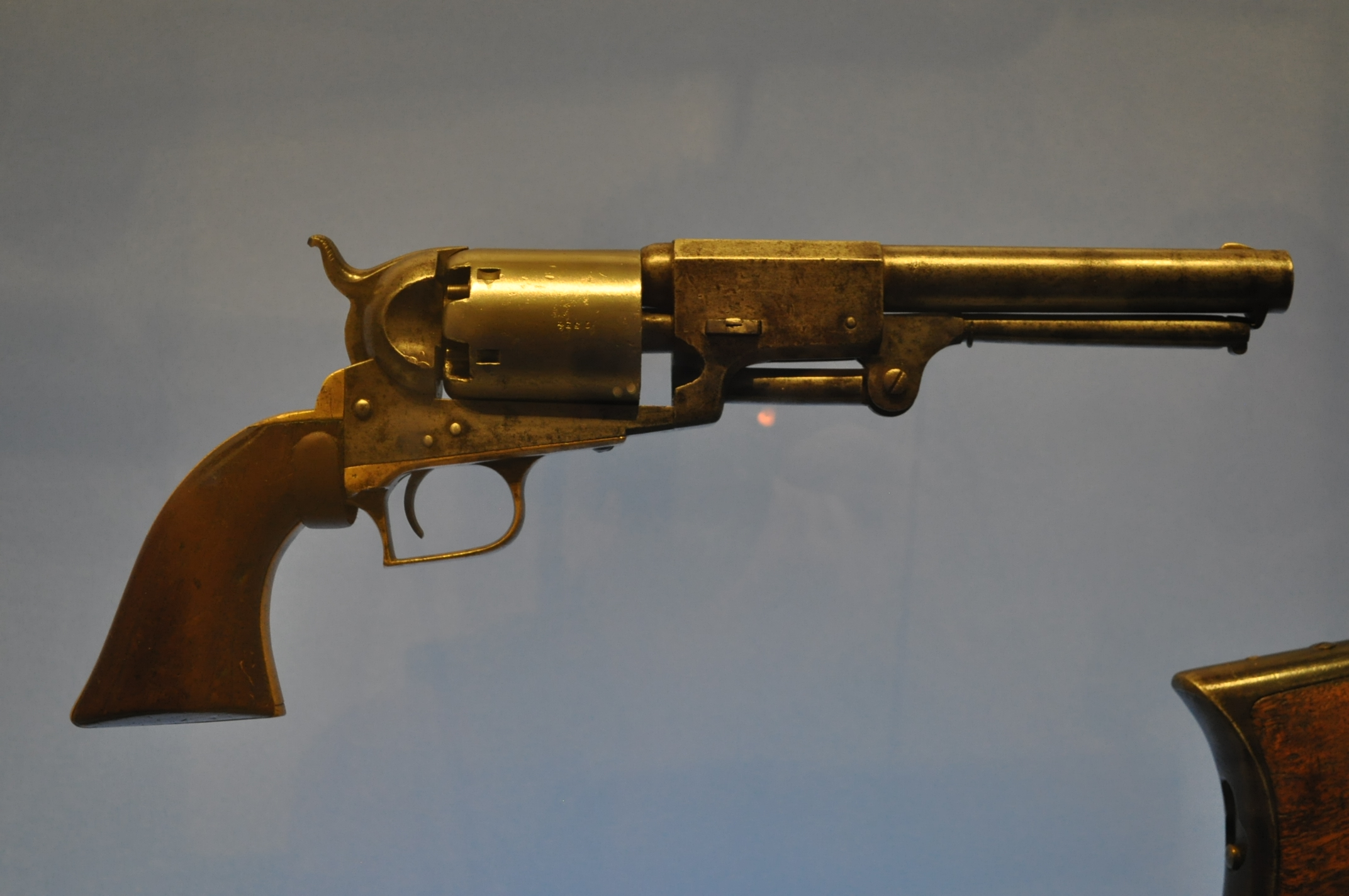 an antique revolver on display with the sights pointing towards it