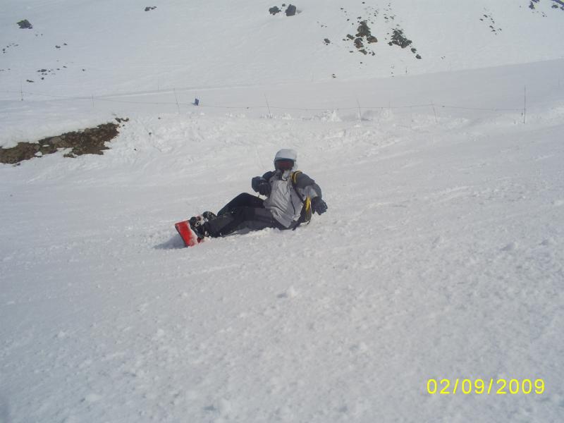 a person on skis is laying in the snow