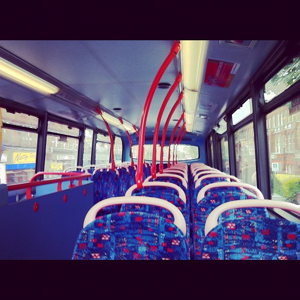 empty bus with multiple seats sitting in a row