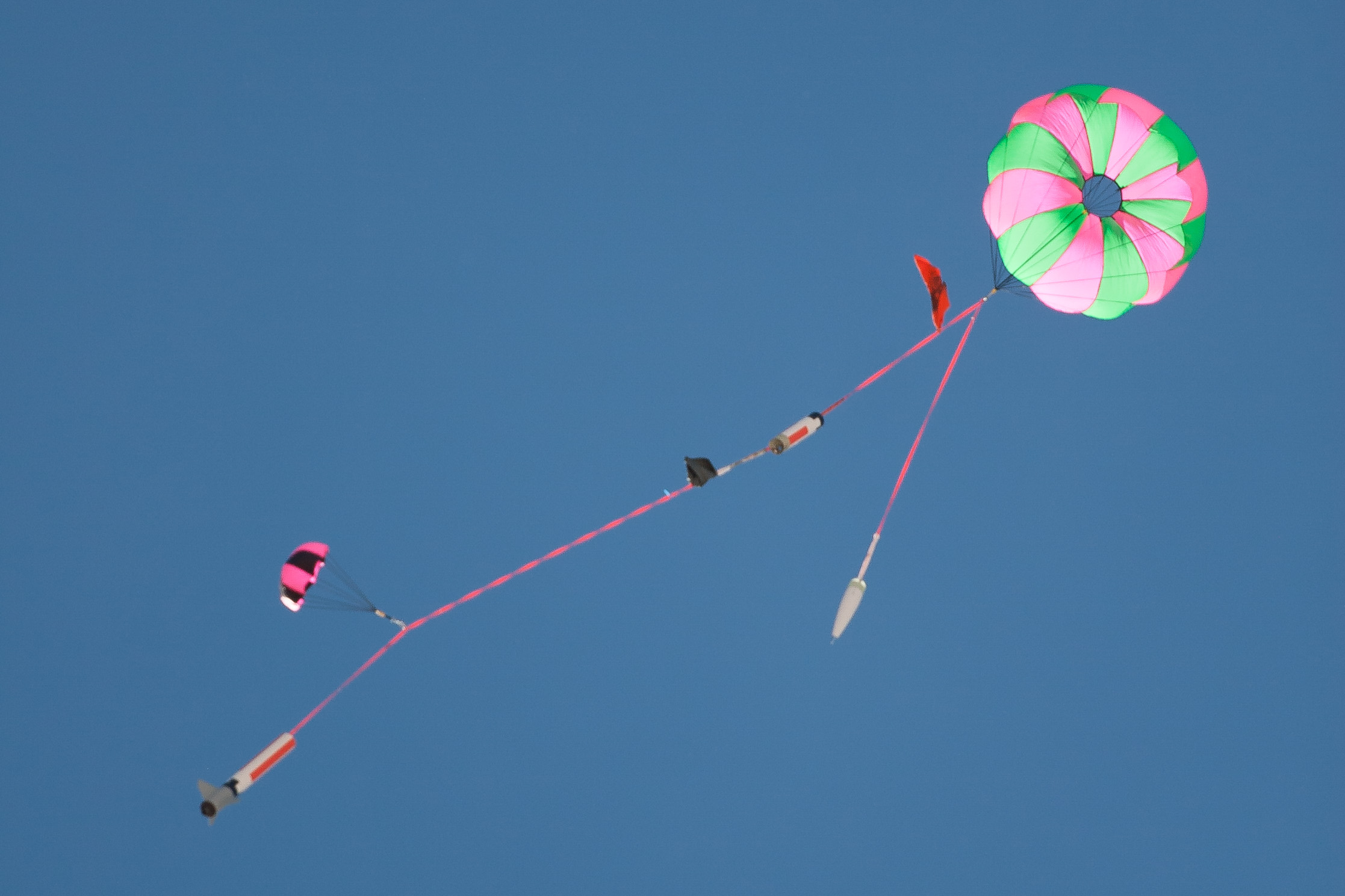 a kite being flown upside down on a clear day