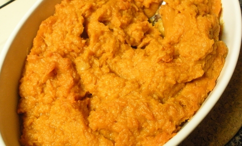 a casserole dish with pumpkin toppings on a counter