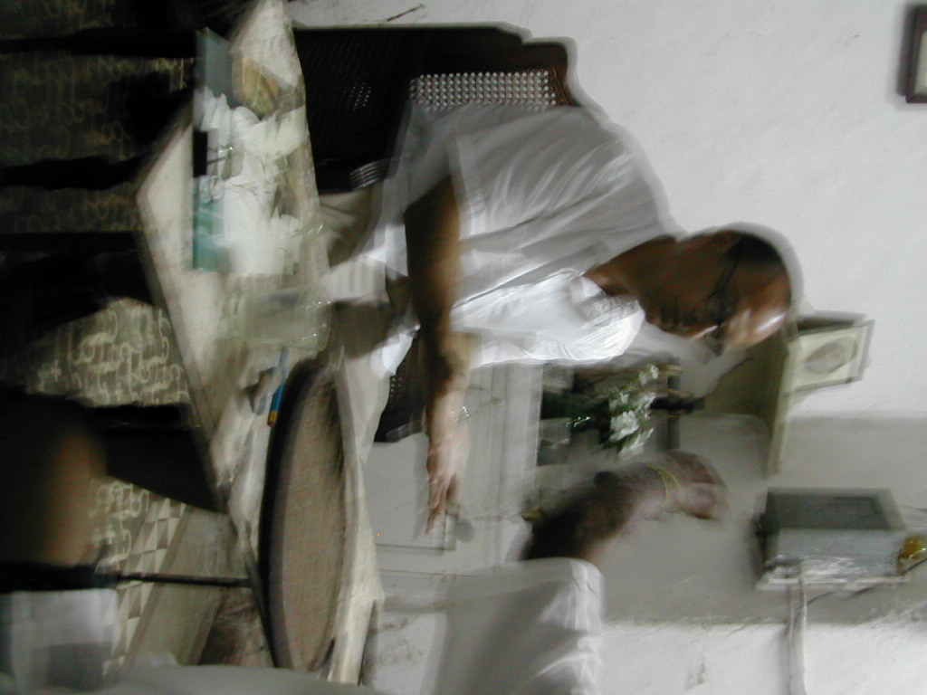 a blurry image of a man in white shirt and pants