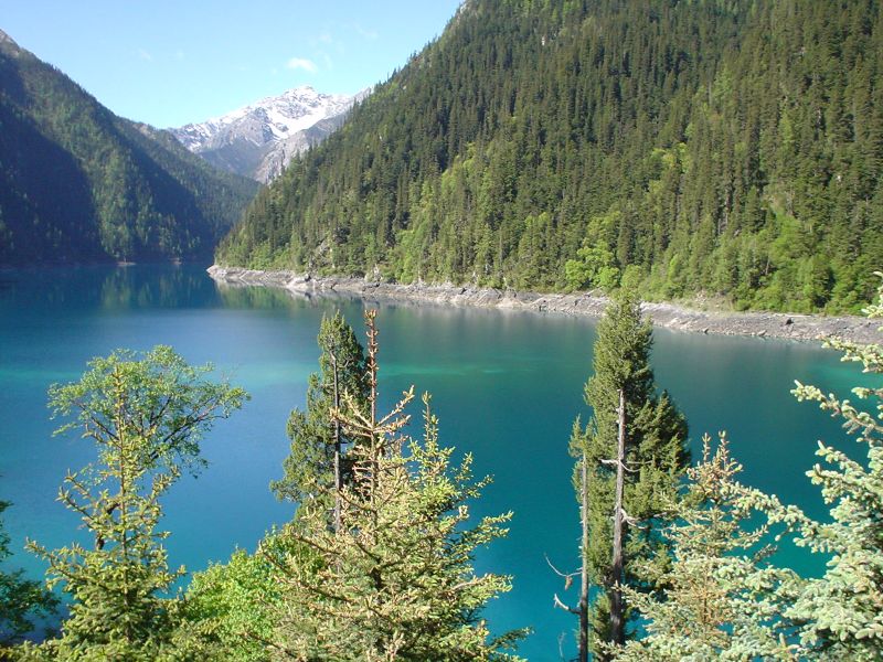 a lake and some mountains in the background